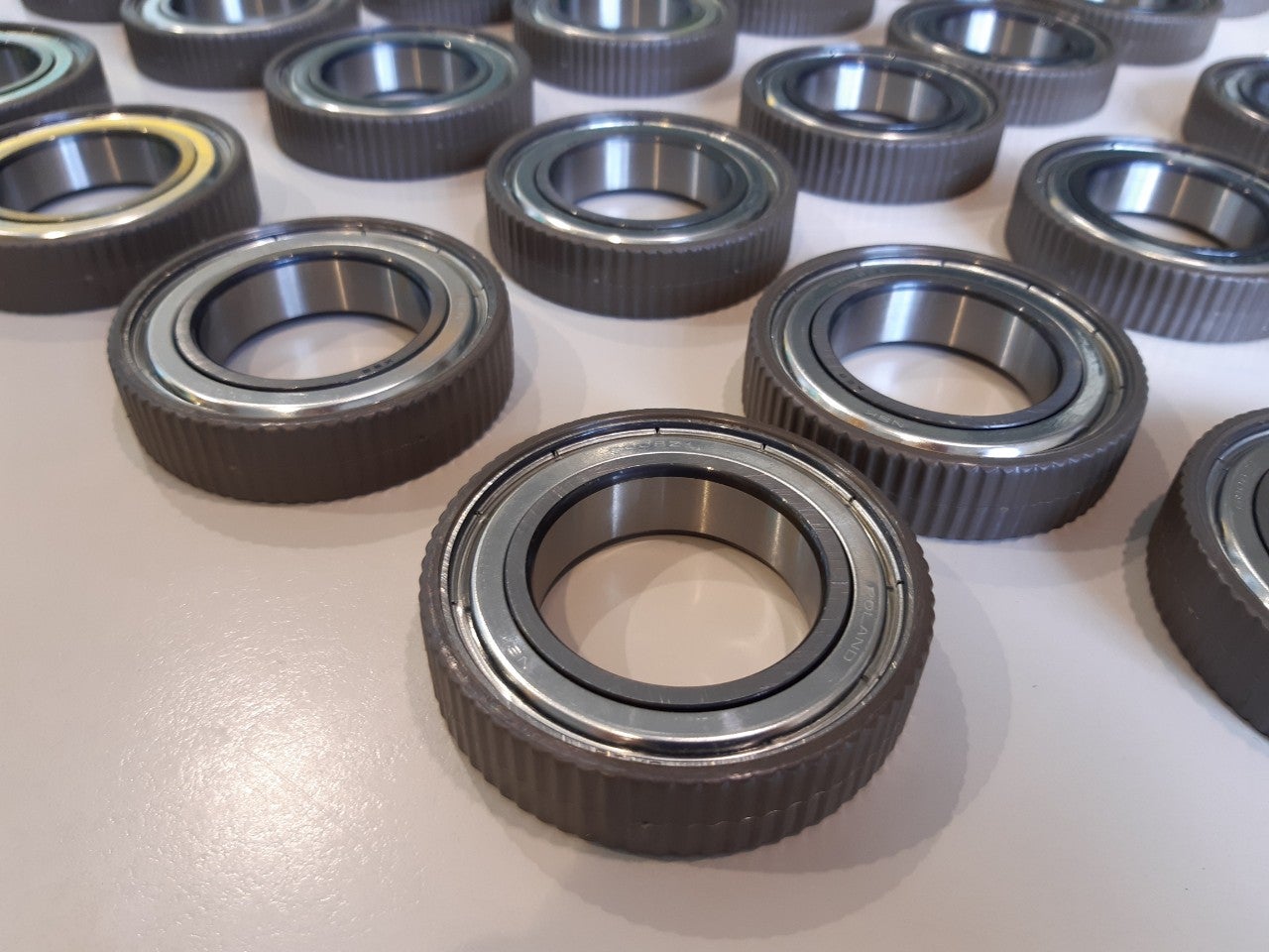 Over-moulding for deep groove ball bearings Over-moulded deep groove ball bearings