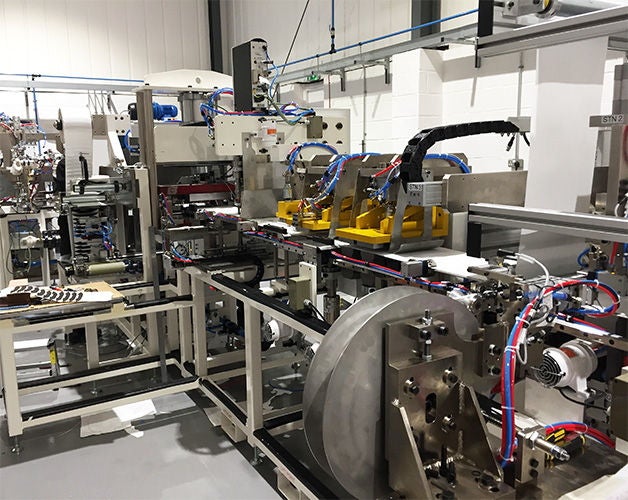 Sims machine in production, NH Linear Guide 1) The automated face mask manufacturing machines built by Sims Engineering feature NH series linear guides from NSK. Photo: Sims Engineering