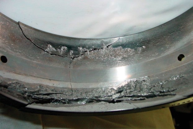 CON_T-S_Flaking.jpg Flaking and fracture in the outer ring raceway of a spherical roller bearing